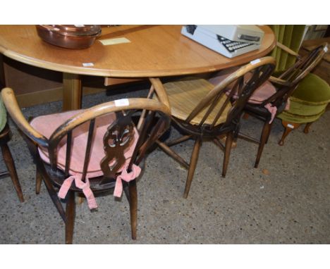 SET OF FOUR ERCOL STYLE WHEEL BACK DINING CHAIRS COMPRISING TWO CARVERS AND TWO SINGLE CHAIRS
