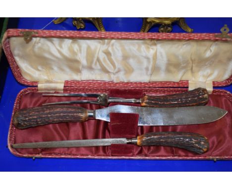 CASED SET OF A CARVING KNIFE AND FORK AND A SHARPENER WITH BONE HANDLES