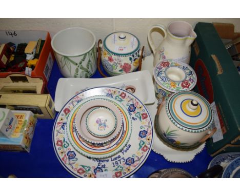 GROUP OF POOLE WARES INCLUDING TWO BISCUIT BARRELS WITH WICKER HANDLES