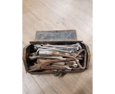 A METAL TOOL BOX CONTAINING SPANNERS ETC
