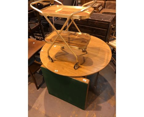 Circular dining table with extending panel with further card table and drinks trolley