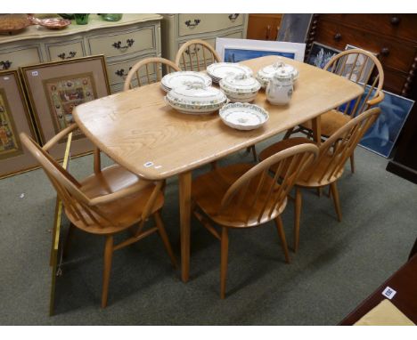 Ercol Blonde Elm dining table on outstretched legs and a matching set of 6 Ercol Windsor chairs 