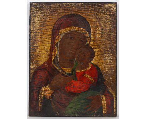 An orthodox icon painted with Madonna and child, oil on panel, 38 x 29cm