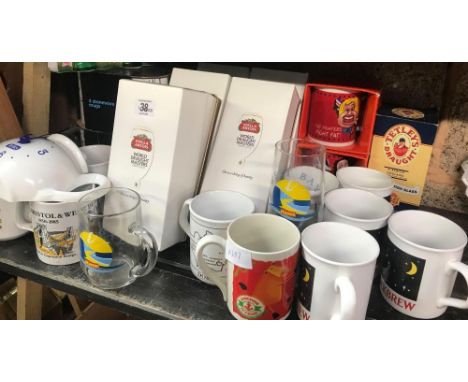 SHELF OF VARIOUS COFFEE, TEA MUGS, TETLEY TEA POT CLOCK, STONEWARE MUGS, COCA-COLA GLASSES, STELLA ARTOIS GLASSES &amp; OTHER