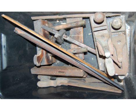 A box of hand tools, to include a hand saw, various woodworking planes, slide rule etc