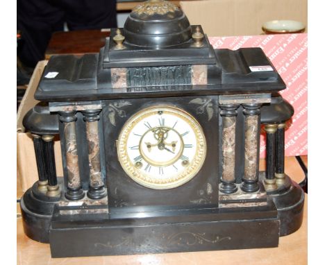 A late Victorian black slate and marble mantel clock of architectural form having enamelled dial with Roman numerals, visible