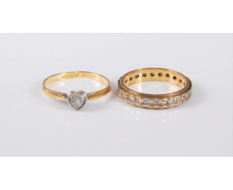 Two diamond rings: a 9ct diamond eternity ring, estimated approx. 0.25cts, in white and yellow gold, size N-O, (2.8g), togeth