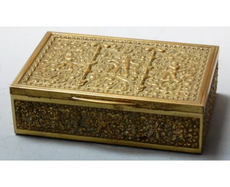 An Eastern brass table cigarette box, of rectangular form, the lid relief decorated with cherubs amongst scrolling foliage, w