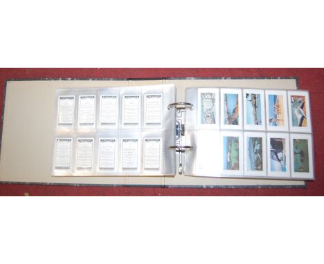 A box of cigarette and tea card albums, to include Carrera's Ltd, Will's, Whitbread signs etc. To include The History of Whit