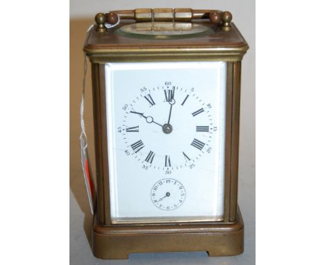 A circa 1900 French lacquered brass carriage clock, with alarm, having main dial over alarm dial (cracked), visible platform 