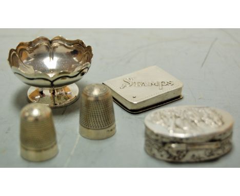 Assorted silverware, to include two thimbles, embossed pill/snuff box, stamp case, and a miniature footed bowl