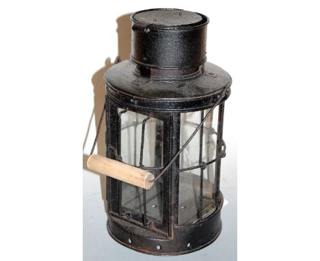 A WWI style black painted iron trench lantern, with swing handle, h.31cm (excluding handle)