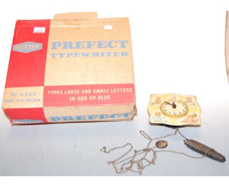 A boxed Mettoy tin plate Perfect typewriter, No. 4320, together with a childs Chad Valley tin plate wall clock (2)
