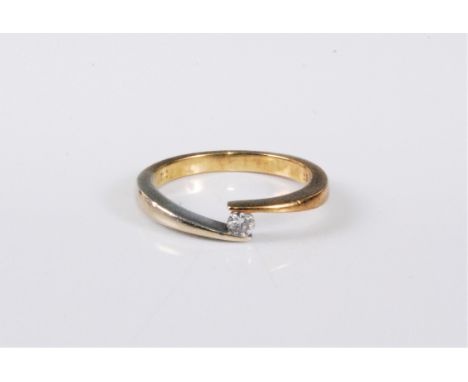 A 9ct diamond solitaire ring, the round brilliant cut diamond, estimated 0.10cts, in tapered crossover style band, stamped 37