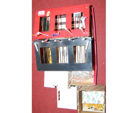 A boxed Scalextric A211 First Aid hut by Mini Models Ltd, together with various Scalextric buildings and accessories