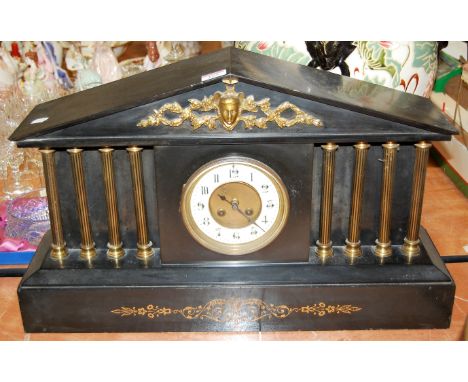 A large circa 1900 black slate and gilt metal mounted mantel clock of architectural form having an enamelled chapter ring wit