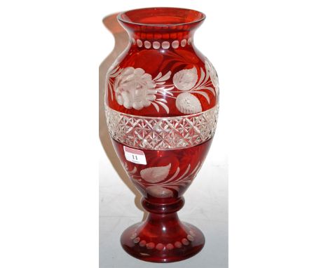 A Bohemian style ruby overlaid glass vase, of baluster form, etched with flowers and foliage, h.32cm