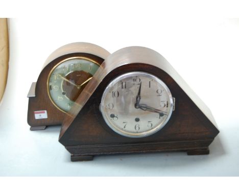A 1930s oak cased mantel clock, having silvered dial with Arabic numerals, and chiming movement; together with a mid-20th cen