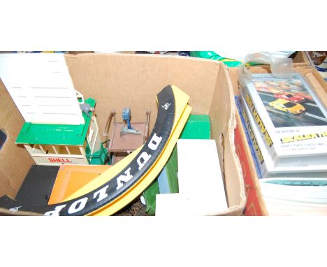 Three boxes of Scalextric accessories, to include Dunlop bridge, track, magazines and videos etc