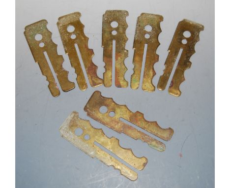 A collection on seven post-WWII brass button sticks, all by J.R. Gaunt &amp; Sons, with War Department arrows (7)