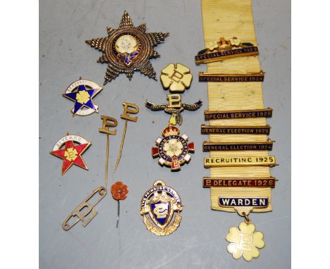 A Primrose League enamelled star badge, together with various Primrose League stick pins, Special Service bars etc