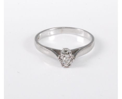 A platinum diamond solitaire ring, the round brilliant cut diamond, estimated approx. 0.06cts, illusion mounted in platinum w