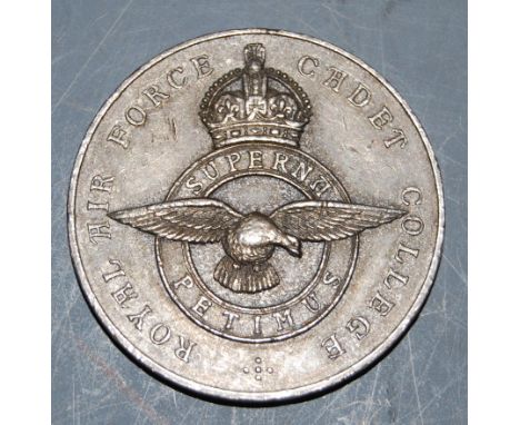 A Royal Air Force Cadet College white metal medal, inscribed Contest Versus Trinity Hall Cambridge 1928 100yds First, naming 