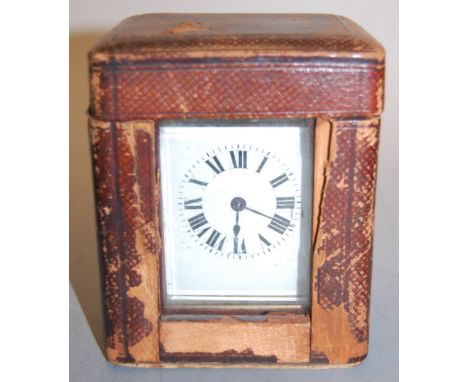 An early 20th century lacquered brass cased carriage clock, having enamelled dial with Roman numerals and visible platform le