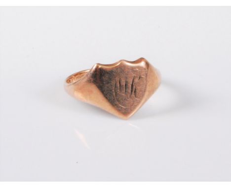 A 9ct gold shield shaped signet ring, (initials worn), stamped 375 with Birmingham assay mark, size S, (3.9g)