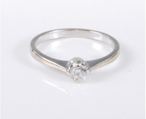 A 9ct gold diamond solitaire ring, the round brillinat cut diamond, estiamted approx. 0.20cts, claw mounted with plain band s