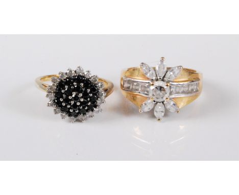 A 9ct gold black and white diamond cluster ring, estimated approx. 0.74cts, stamped with Common Control mark, 375, with Londo