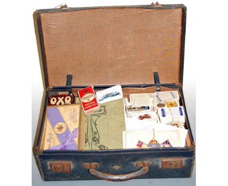 A small leather suitcase and contents, to include WWI sweetheart greetings cards, Churchman's Suffolk Churches cigarette card