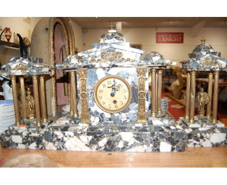 A large late 19th century veined marble and gilt brass mounted clock garniture of architectural form, the clock with paper di