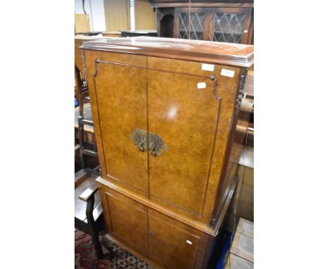 A vintage walnut cocktail cabinet