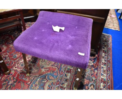 A vintage dressing table stool having metal frame and purple dralon upholstery