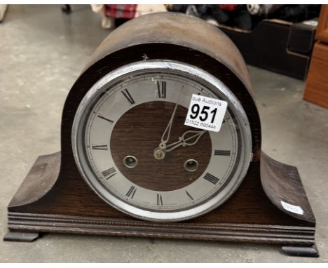 An oak mantle clock