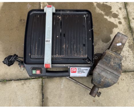 A Performance power electrical tile cutter &amp; A heavy vice.
