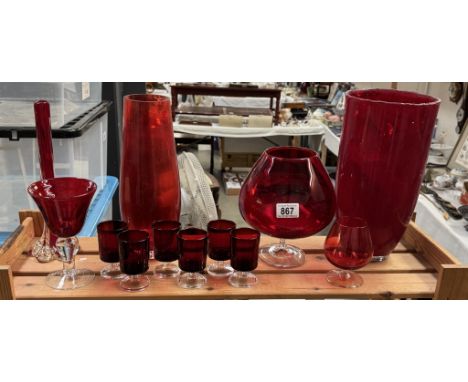 A varied selection of ruby red coloured glass including vases, large brandy glass etc