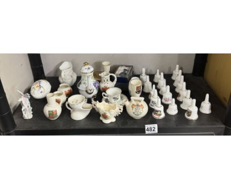 A quantity of crested China and ceramic bells,
