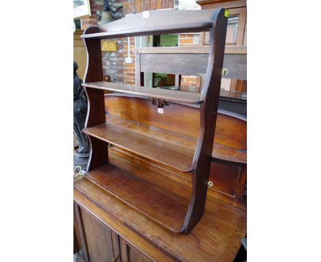 An antique mahogany hanging open shelf,&nbsp;64cm wide.&nbsp; 