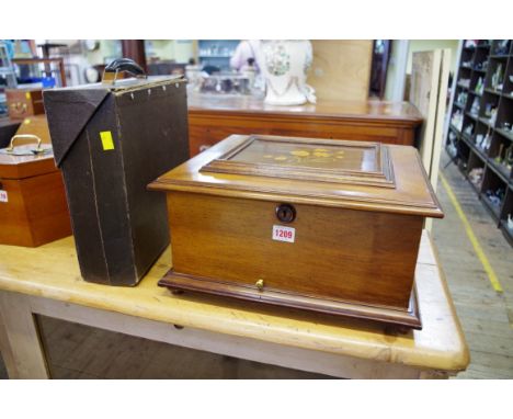 A Polyphon walnut and inlaid music box,&nbsp;playing 11in discs, the mechanism numbered 191, 40.5cm wide, with winding key an