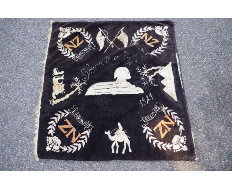 A World War II 'New Zealand 1st Division, 8th Army' (Desert Rat) embroidered panel, inscribed 'Souvenir of Egypt 1941', 85 x 
