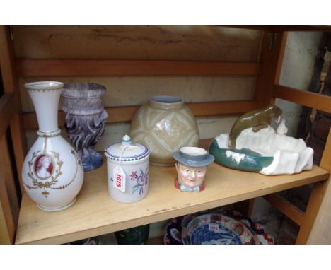 A Japanese porcelain ovoid vase, mark to base, 14.5cm high; together with an unusual Austrian pottery walrus and penguin moun