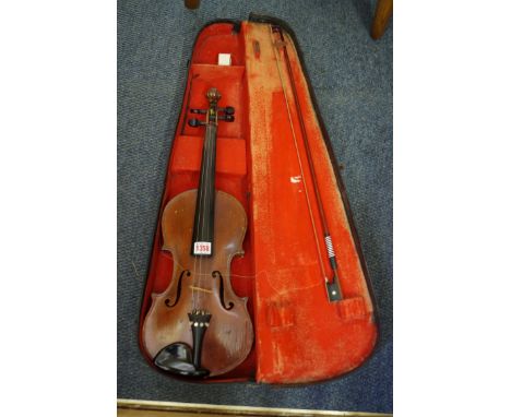 An antique Continental violin, labelled 'Antonius Stradivarius...', with 14in two piece back, with bow and case; together wit