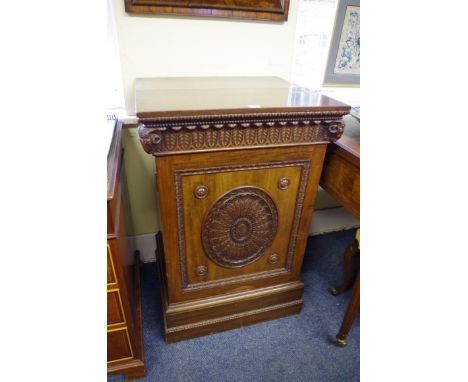 A good circa 1900 carved mahogany dining room pedestal, in the Robert Adam style, the door opening to reveal a drawer and she