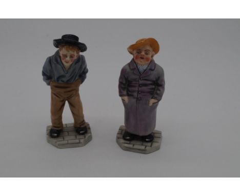 A rare pair of Victorian Royal Worcester porcelain figural menu holders,&nbsp;from the 'Down and Out' series, by James Hadley