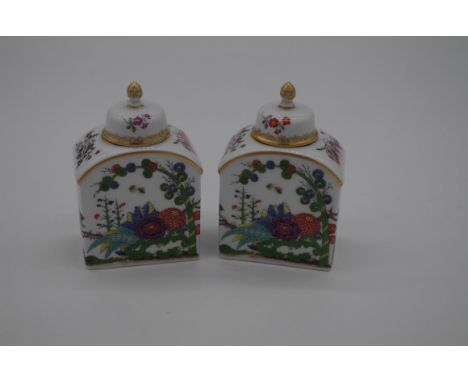 A small pair of Meissen tea canisters and covers, 9cm high, (finial of one restuck).&nbsp; 