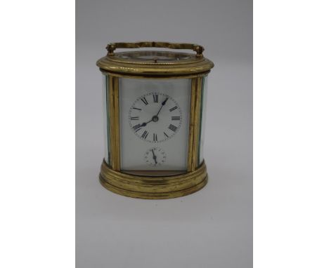 A good antique brass oval grande and petite sonnerie carriage clock,&nbsp;with alarm and push button repeat, striking on two 
