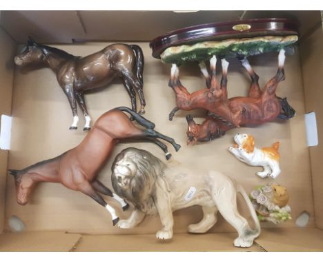 A mixed collection of items to include a Melba Ware lion figure, resin Crosa Collection horse and foal figural group on woode