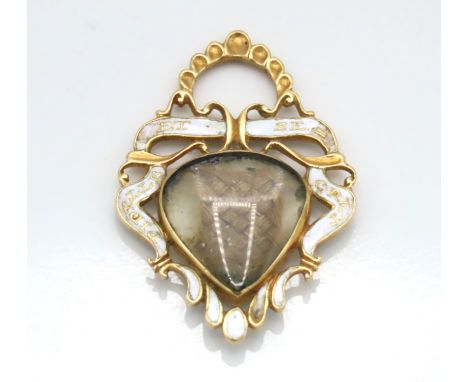 A Victorian yellow metal memorial pendant set with enamel decor, some faults, 30mm drop, tests electronically as 18ct gold, 3